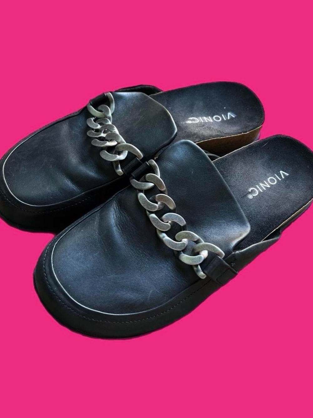Black slip-on mules with silver chain detail